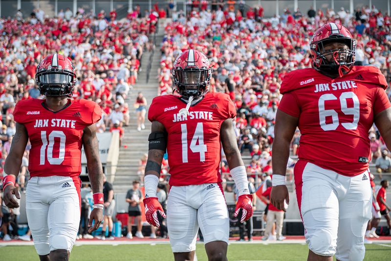 Jacksonville State captains Zion Webb (10), Jeremiah Harris (14) and Treylon Brown (69) take the field for the coin-toss prior to a game vs. UTEP at Burgess-Snow Stadium in Jacksonville last Saturday. The Gamecocks won 17-14 in their first game as an FBS program. (Brandon Phillips/Jacksonville State athletics)