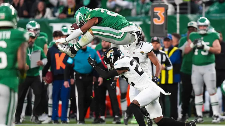 Eagles running back Saquon Barkley hurdles over Jacksonville Jaguars cornerback Jarrian Jones, Sunday, Nov. 3, 2024, in Philadelphia. (AP Photo/Chris Szagola)