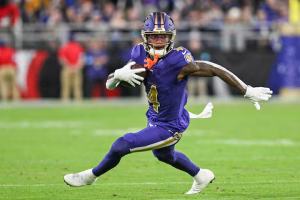 Nov 7, 2024; Baltimore, Maryland, USA; Baltimore Ravens wide receiver Zay Flowers (4) runs after a second quarter catch against the Cincinnati Bengals at M&T Bank Stadium. Mandatory Credit: Tommy Gilligan-Imagn Images Purchase Licensing Rights