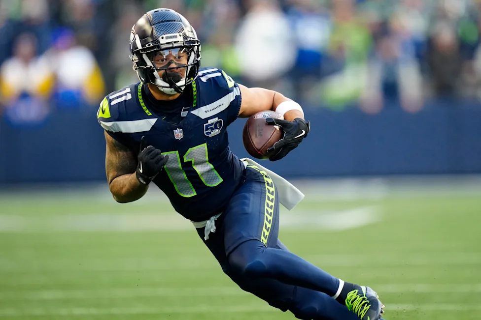 Seattle Seahawks wide receiver Jaxon Smith-Njigba (11) runs with the ball during the NFC Championship NFL football game, Sunday, Jan. 25, 2026, in Seattle. (AP Photo/Ben VanHouten) (ASSOCIATED PRESS)